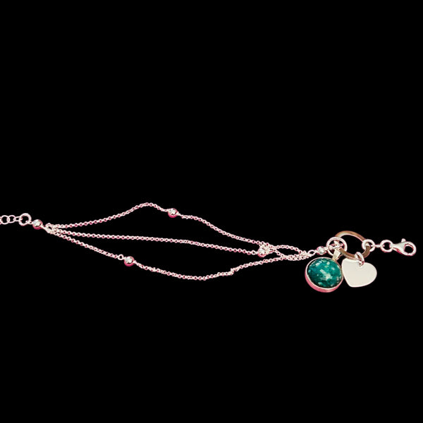 Precious Ashes cabochon pendant on a sterling silver multi strand bracelet