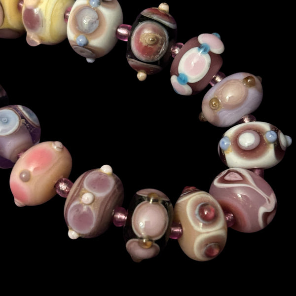 Handmade glass mini fantasy beads in mauves, pinks and purples