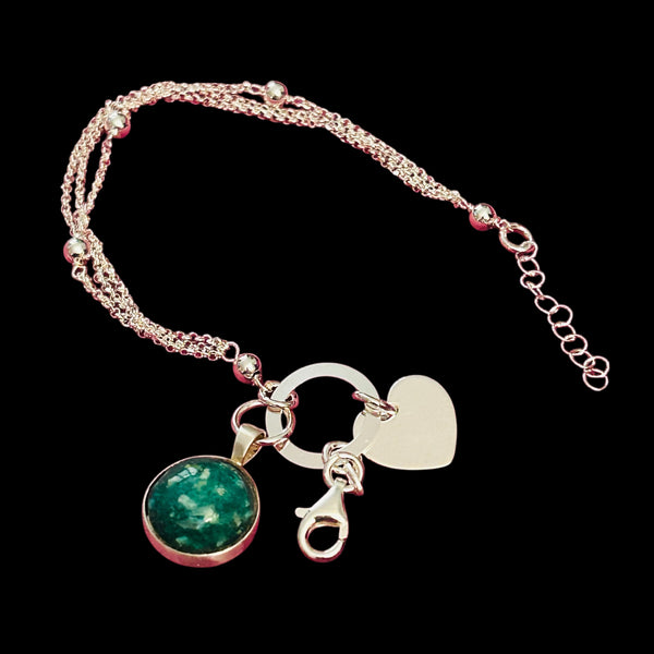 Precious Ashes cabochon pendant on a sterling silver multi strand bracelet
