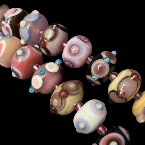 Handmade glass mini fantasy beads in mauves, pinks and purples