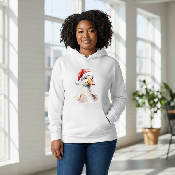 Person wearing a white hoodie with a graphic of a duck wearing a Santa hat in a bright room.