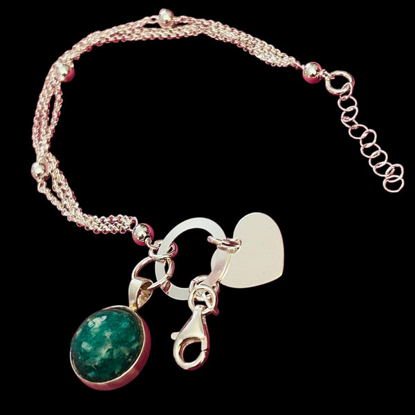 Precious Ashes cabochon pendant on a sterling silver multi strand bracelet