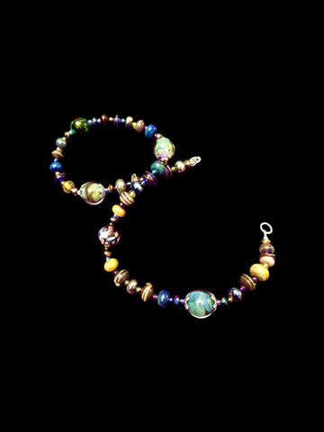 Handmade glass bead necklace and bracelet set in blues, greens and metallic glass, crystals and sterling silver bead caps.