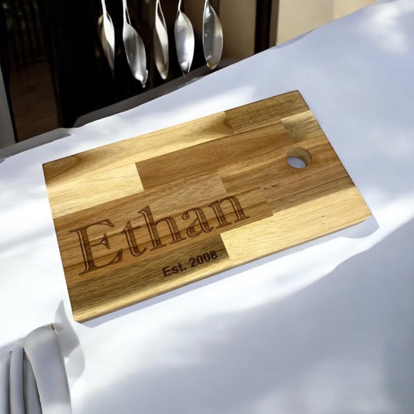 Multi coloured beech Family name chopping board