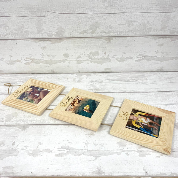 Triple hanging picture frames on twine