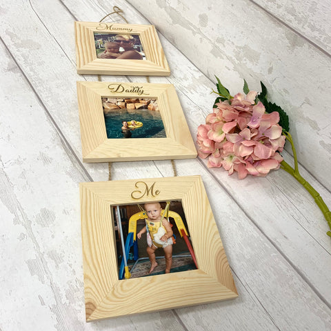 Triple hanging picture frames on twine